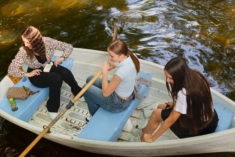 18 - A leisurely afternoon on the water, featuring individuals enjoying a rowboat experience